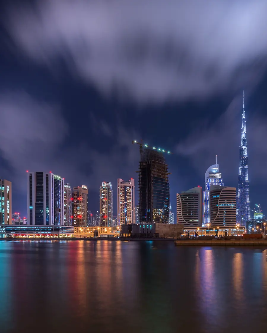 Business Bay and the Dubai skyline reflected in the water at night