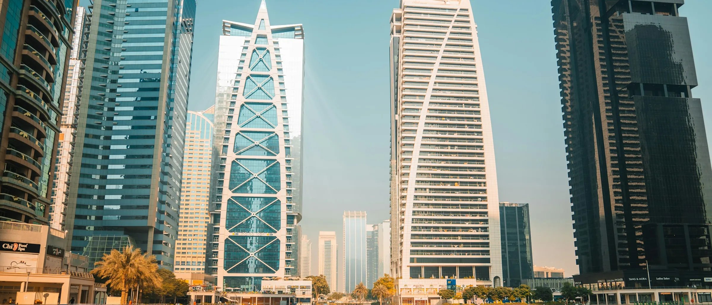 Jumeirah Lakes Towers reflected in the water, the cluster where DMCC companies are licensed