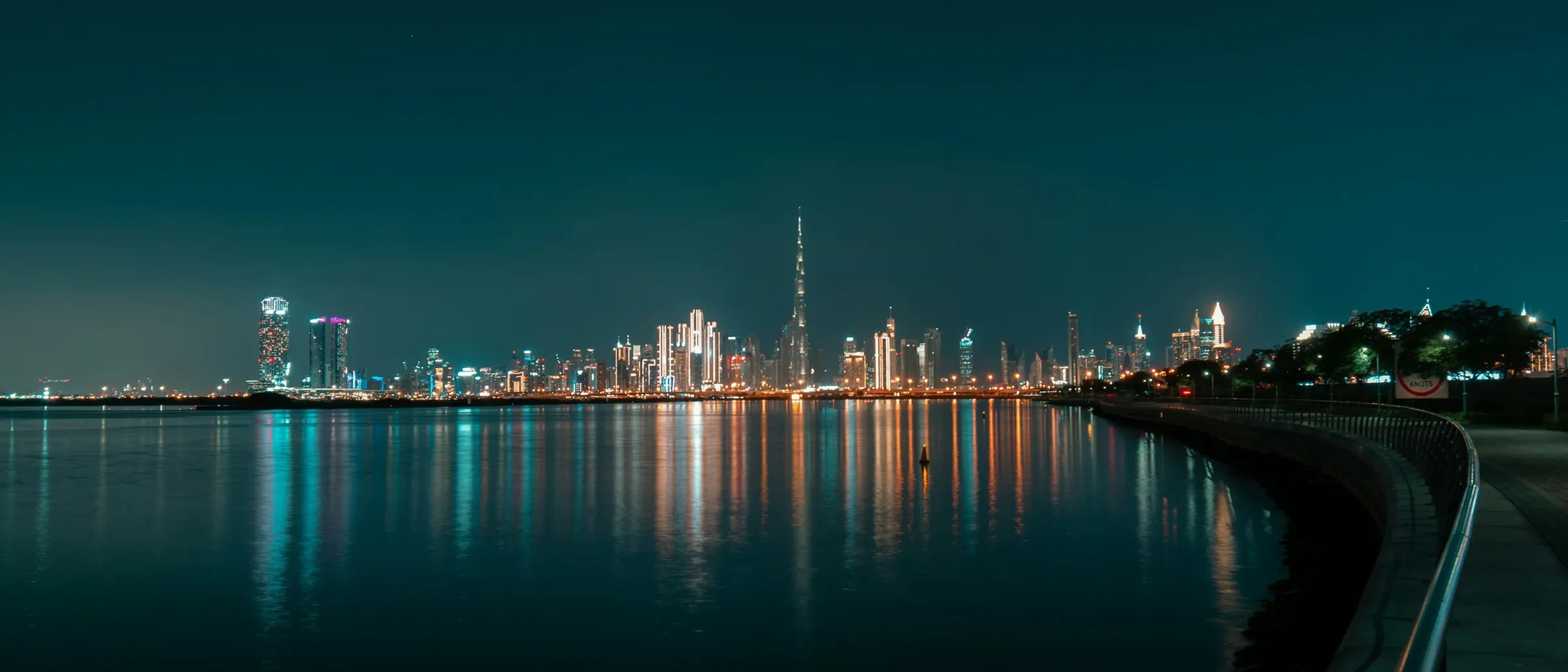The skyline at night seen across the water